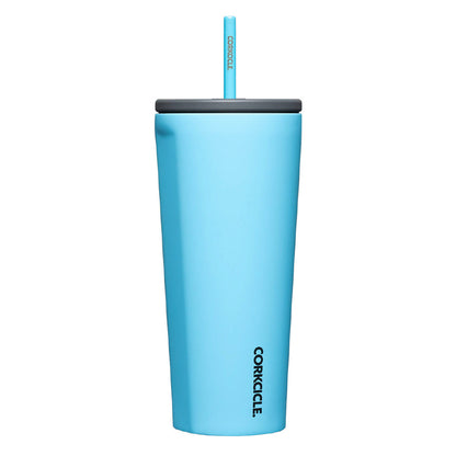 Blue tumbler with a straw on a white background